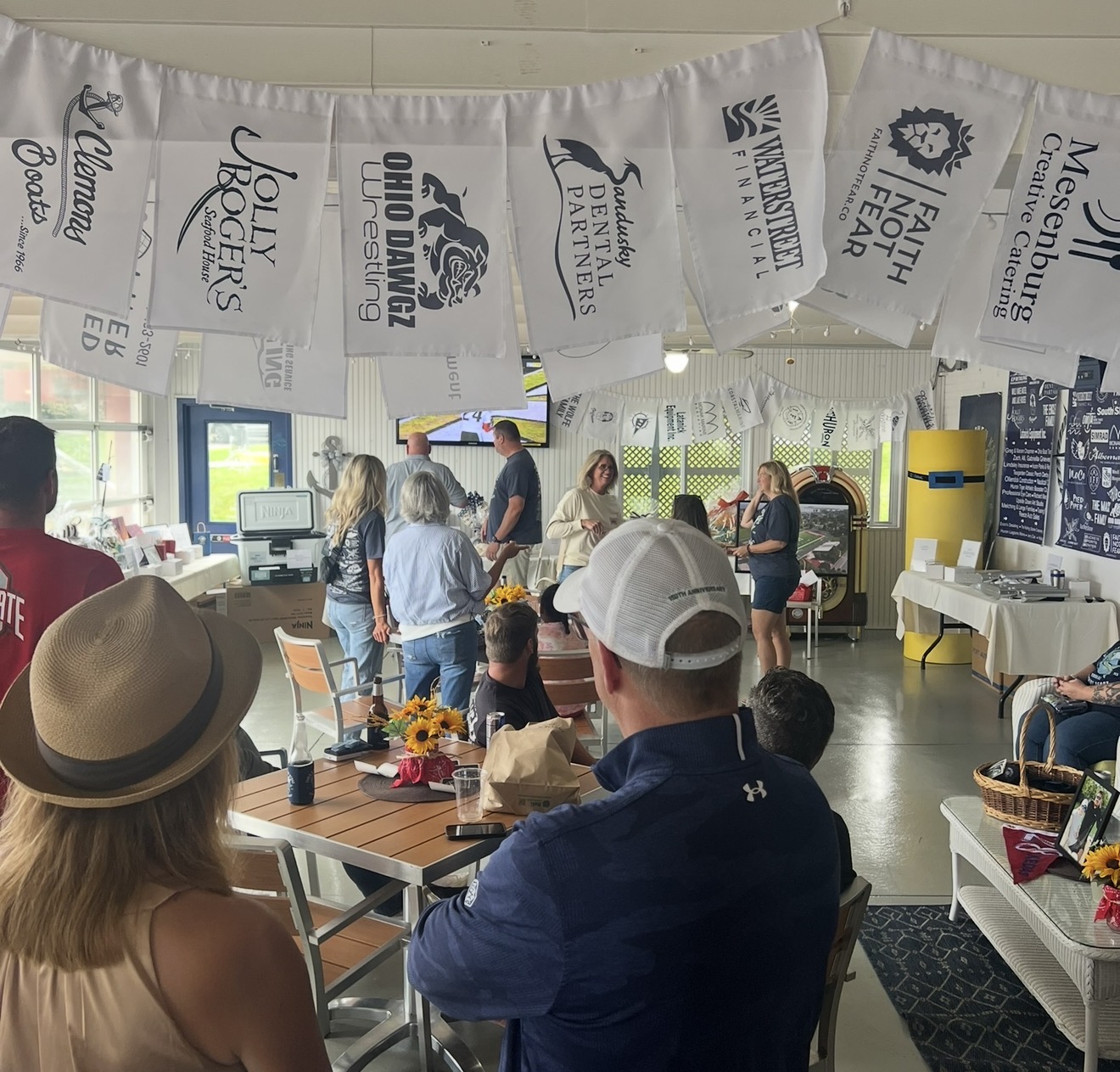 Members gathered for a club gathering in the waterfront pavilion